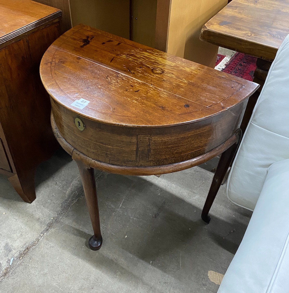 A mid 18th century feather banded mahogany D shaped hinged top side table, width 76cm, depth 46cm, height 76cm